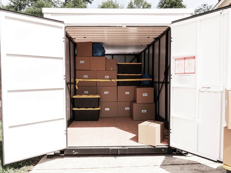 A portable storage container packed with boxes.