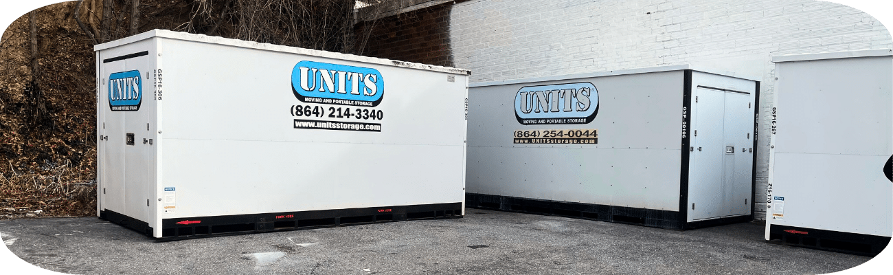 Two portable storage containers owned by UNITS of Asheville, used for moving.