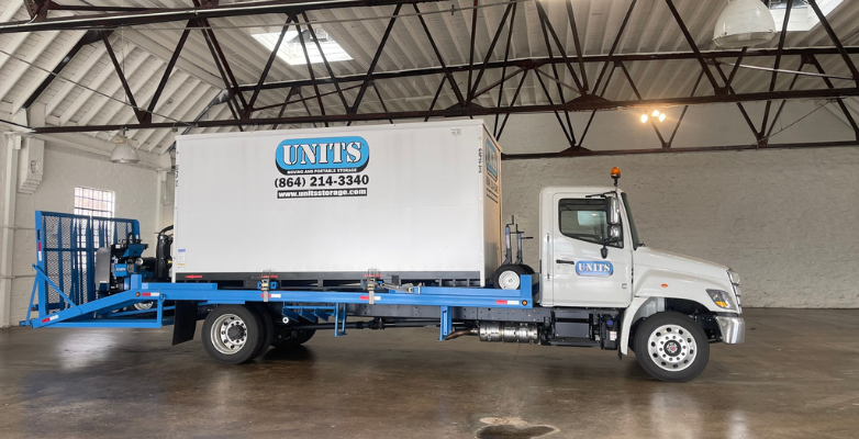 UNITS of Asheville portable storage facility with the truck and container inside.