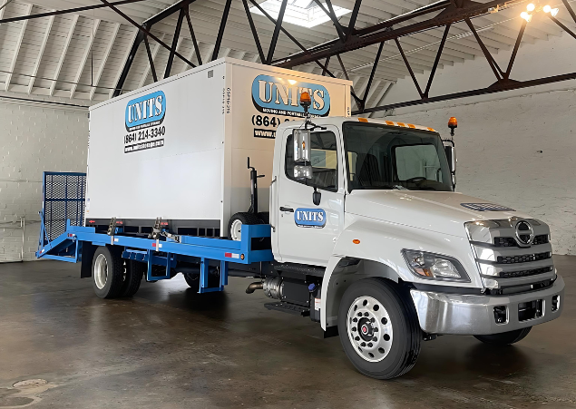 UNITS of Asheville portable storage delivery truck and container in the Asheville storage facility.