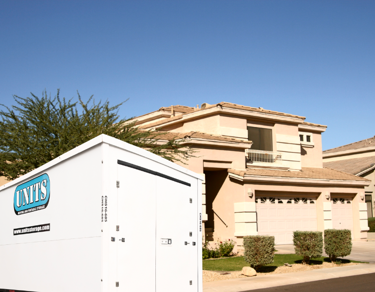 a units container in front of a restored house