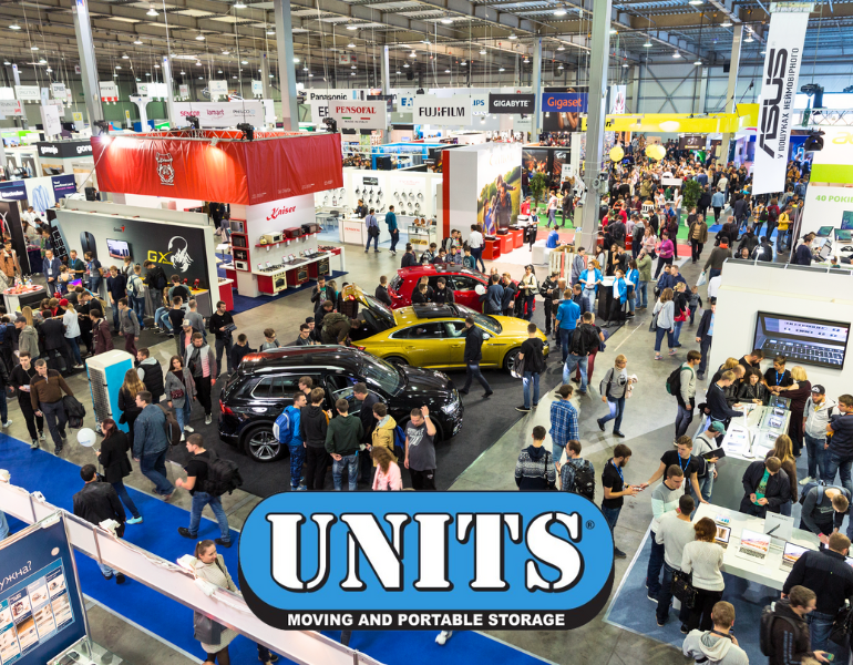 a pic of a busy convention center and units logo