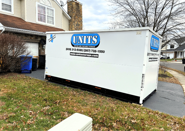 UNITS portable storage container parked in a driveway to help with a move.