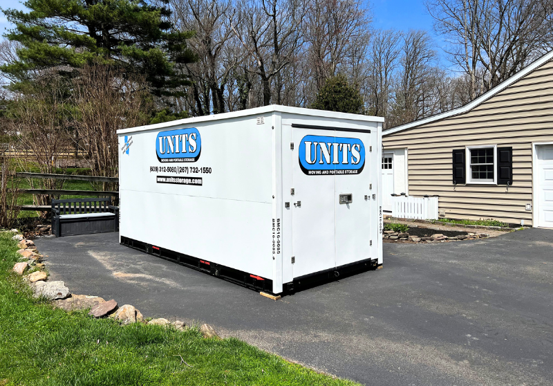UNITS of Bucks Mercer portable storage container parked in a driveway.