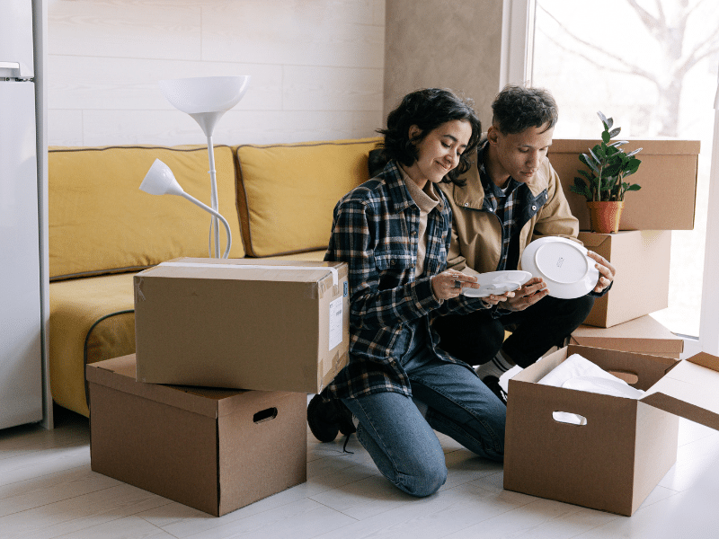 couple unpacking after moving into new home