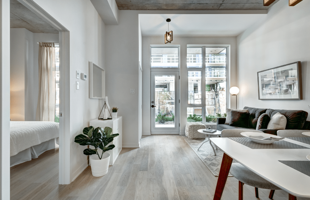 An apartment decorated with white.