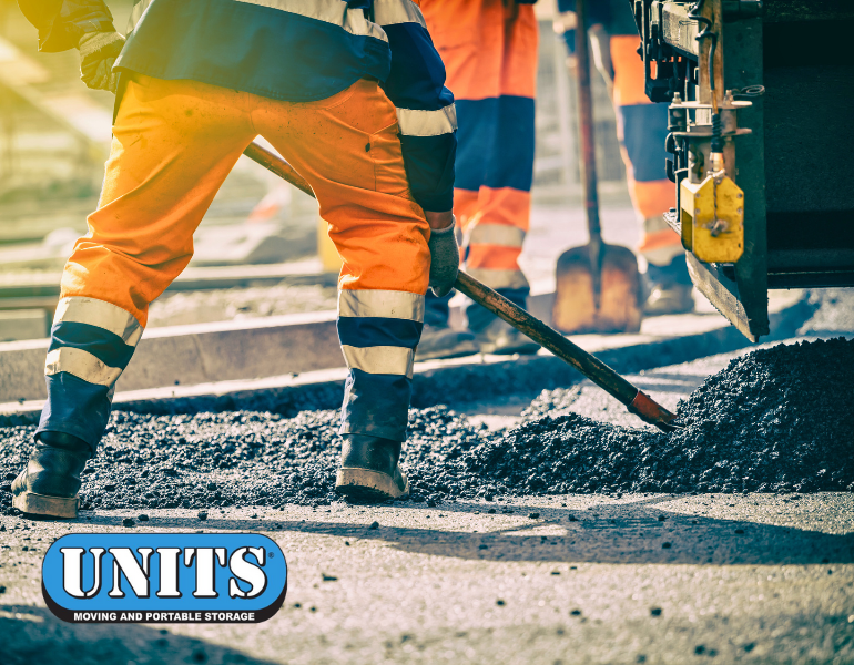 a pic of people doing road construction and units logo
