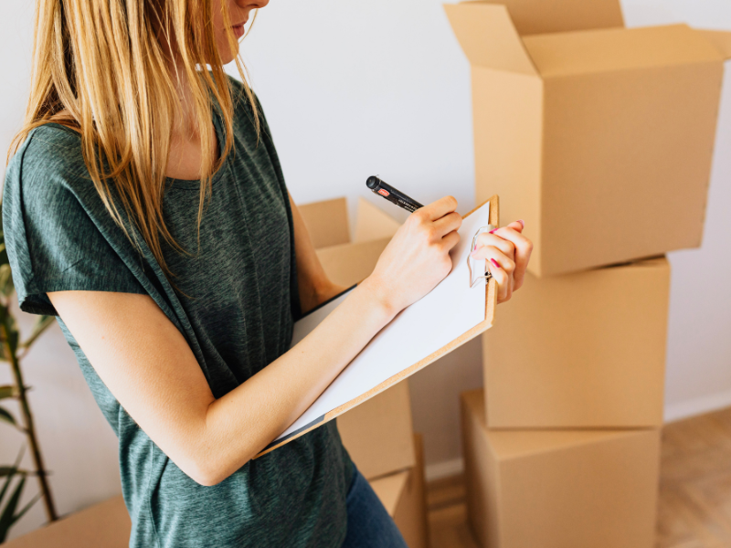 woman going through her summer moving checklist