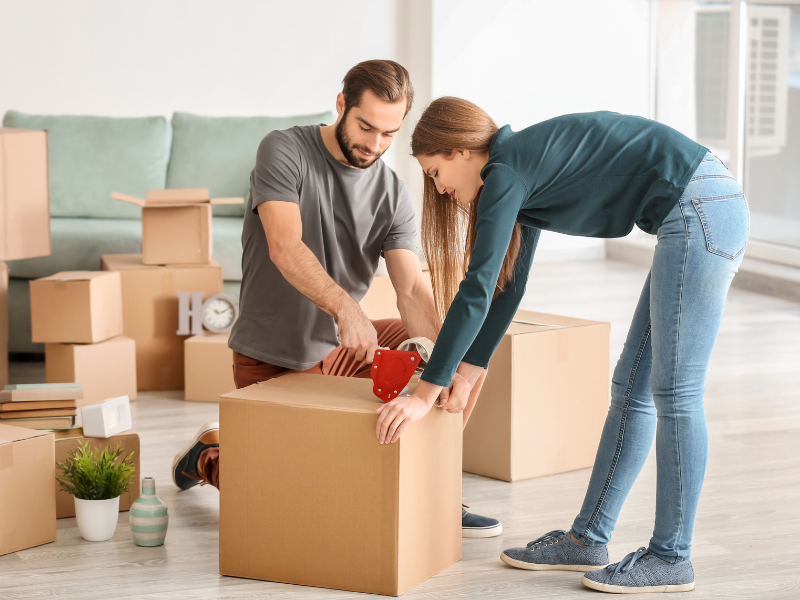 couple packing for their move