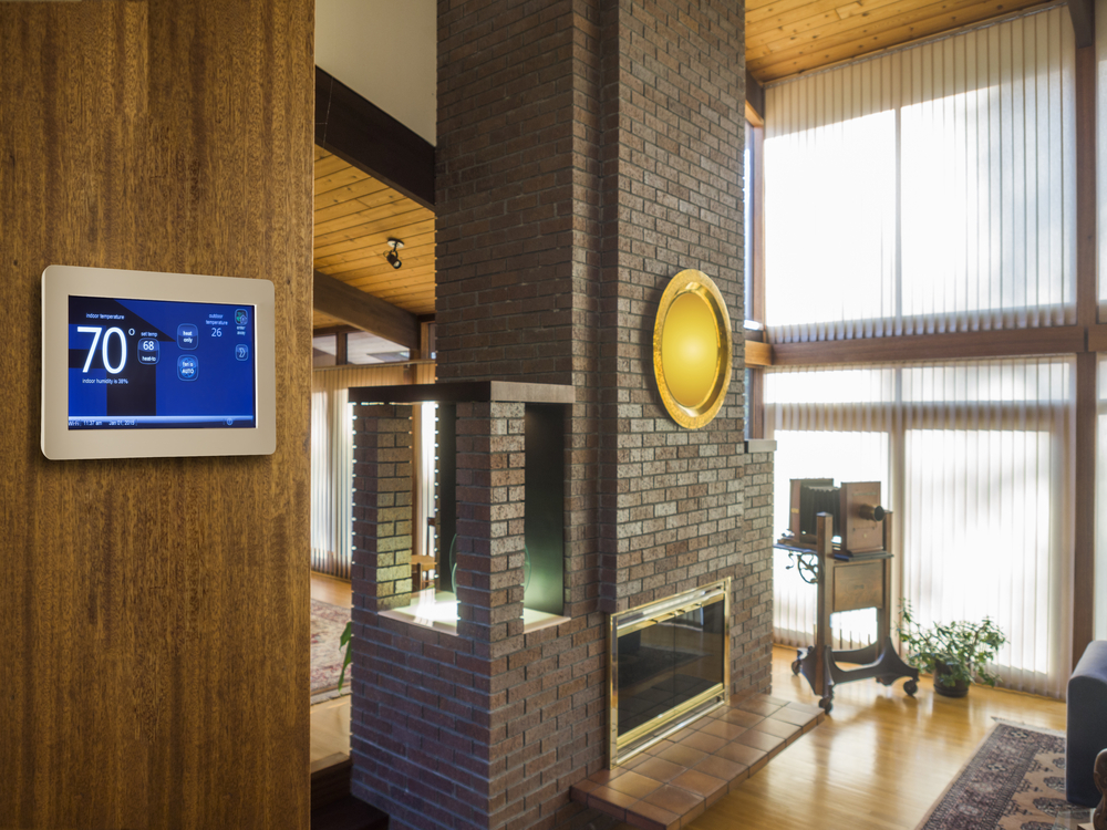 A interior of a house with a thermostat set at 70.