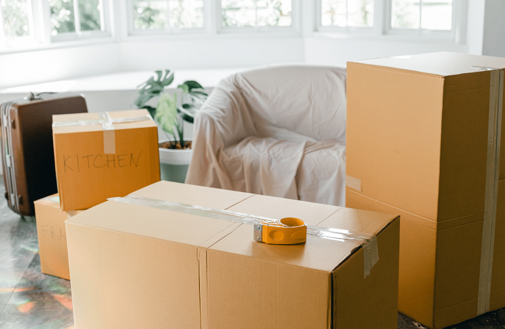 Moving boxes taped sitting on the floor.