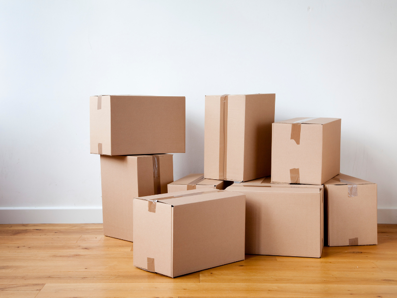 Cardboard boxes sitting on the floor.