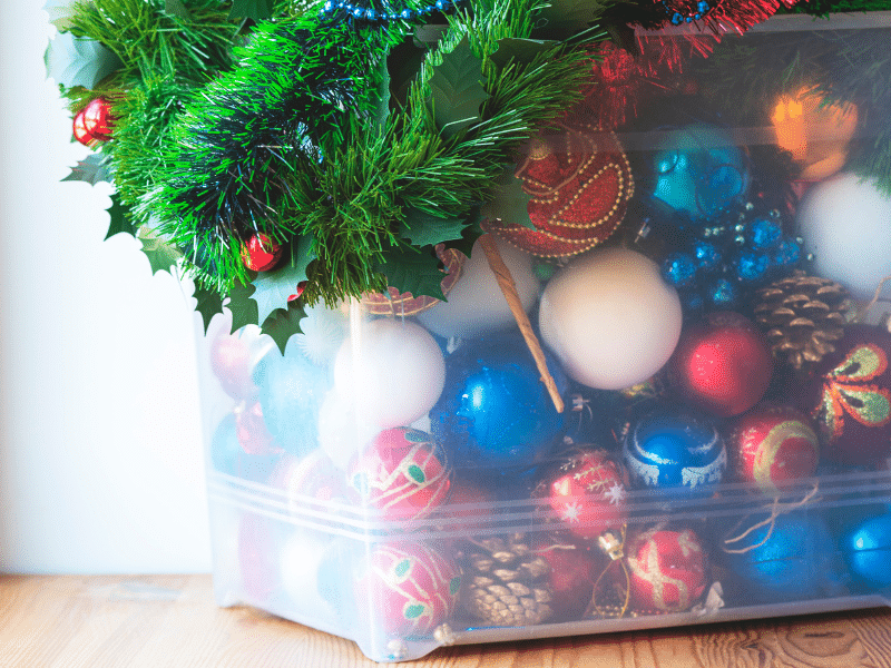 Holiday decorations in a plastic box.