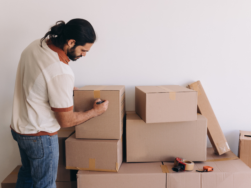 man packing for his move