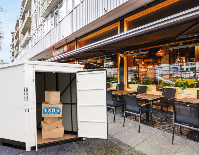 a pic of units container in front of a restaurant