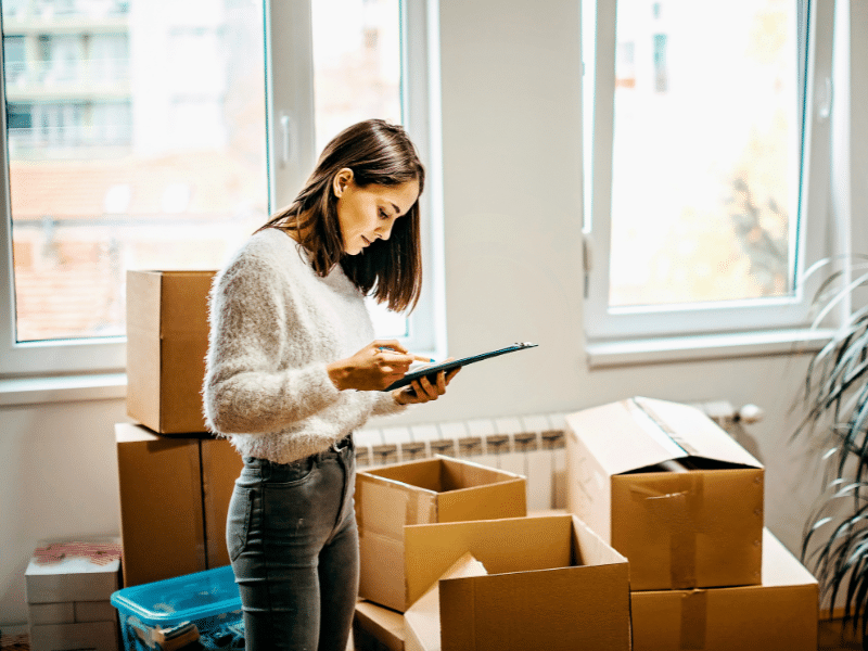 woman looking at her Moving Checklist