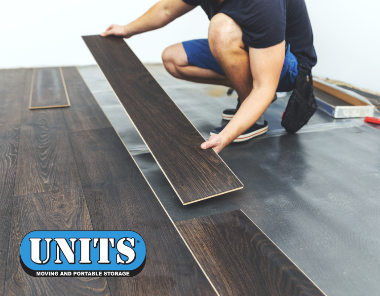 a person putting hardwood floor on with UNITS logo