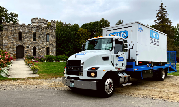 A Units of North Shore truck parked in front of a castle.