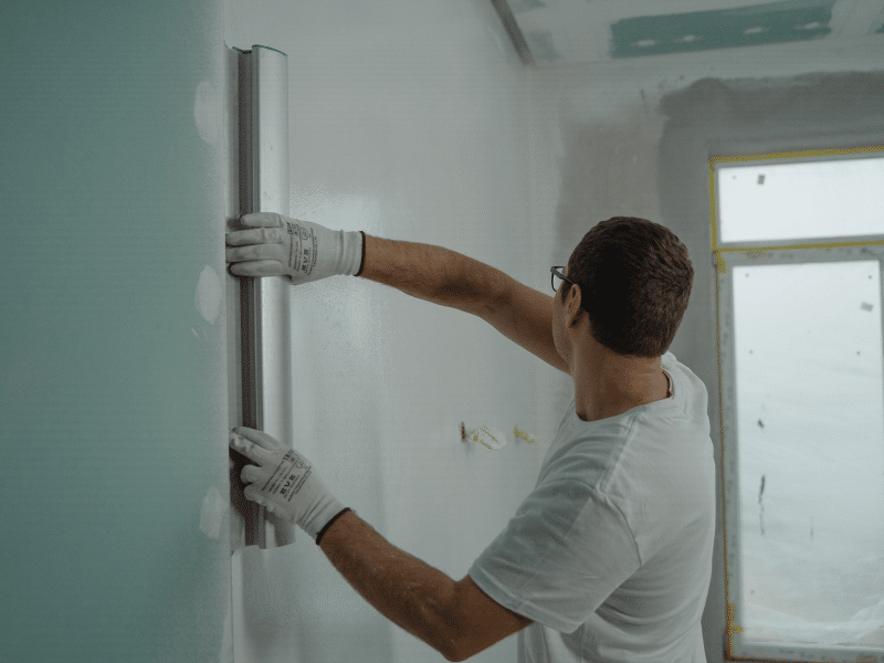 man painting walls for House Renovations