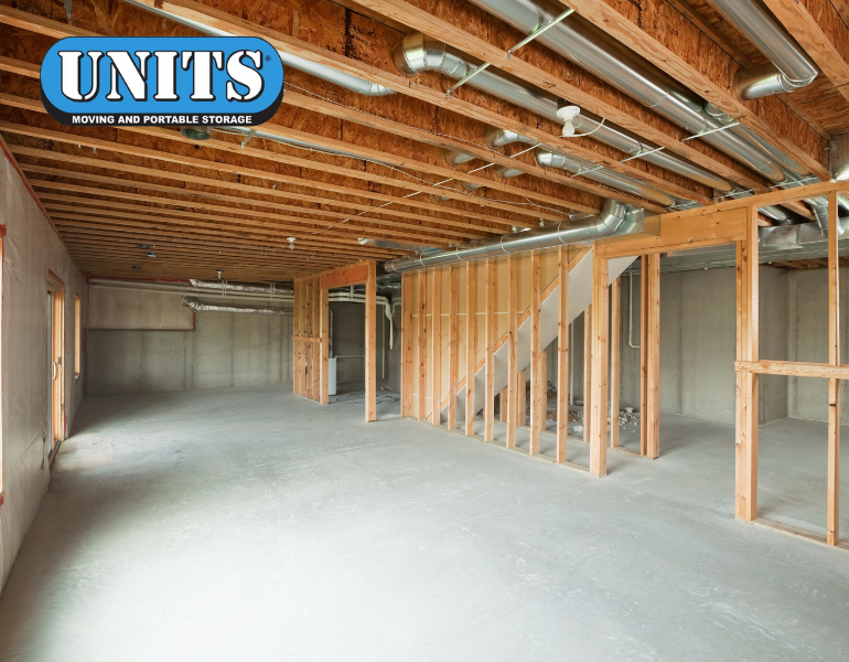 a pic of a an under construction basement and units logo