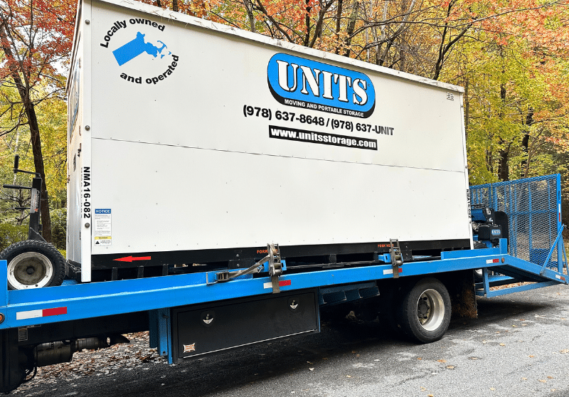 UNITS of Northeast Massachusetts portable storage container on the back of a delivery truck.