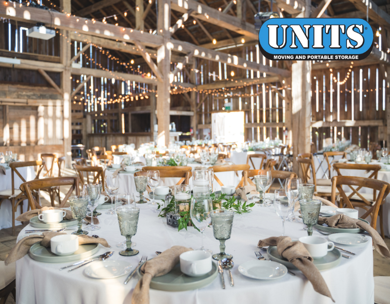 wedding type venue with tables decorated and UNITS logo