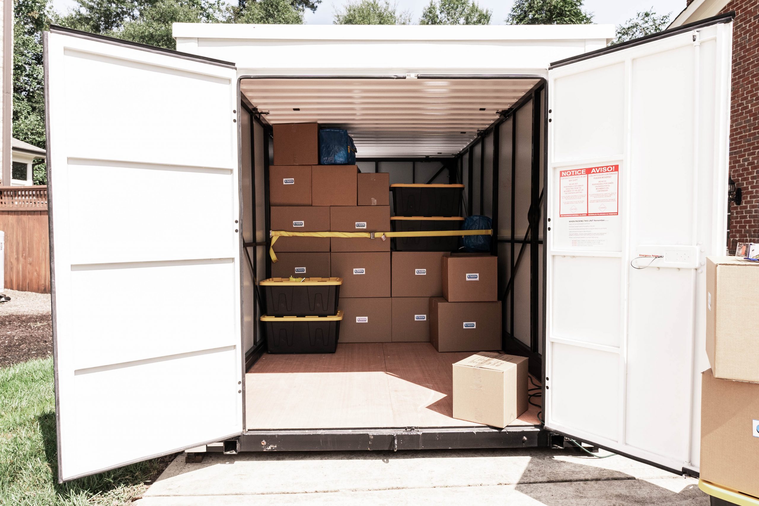 A container with both doors open packed with boxes.