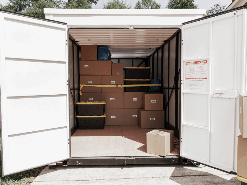 A portable storage container with both its doors open.