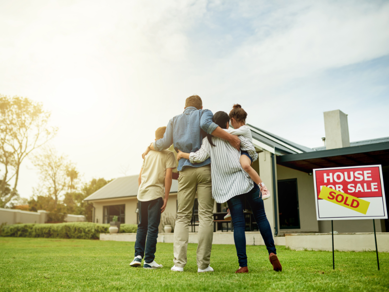 family hugging at new home