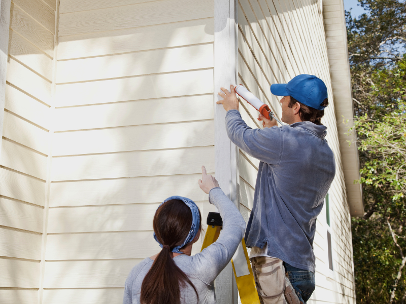 couple performing Annual Home Maintenance