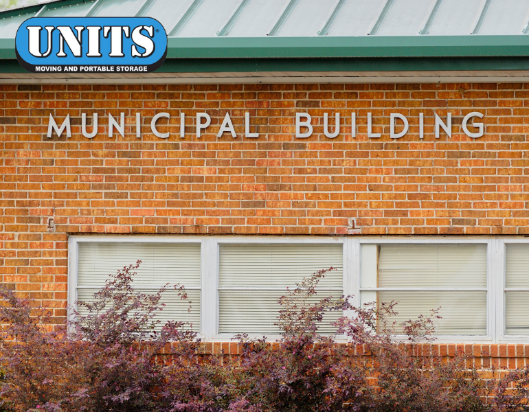 a pic of municipal building and units logo