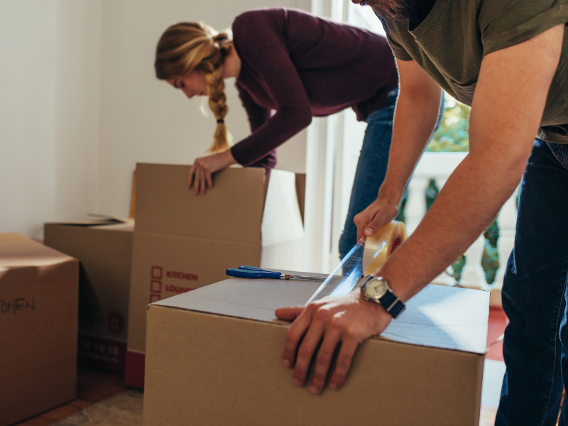 couple packing for their move