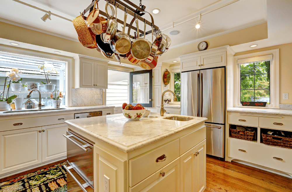 A kitchen clean and decorated with white.