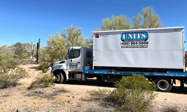 UNITS Moving and Portable Storage of Phoenix container on a UNITS truck in the desert.