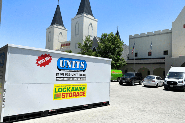 UNITS portable storage container in parking lot in front of castle in San Antonio, Texas.