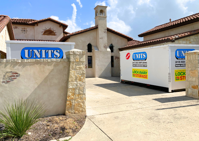 Two UNITS of San Antonio portable storage containers parked on a driveway.