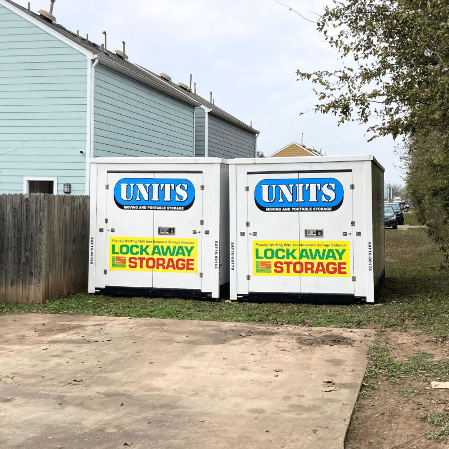 Two UNITS Moving and Portable Storage of San Diego portable storage containers behind a home.