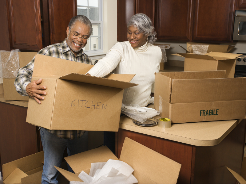 a couple in the middle of the Kitchen Packing Process