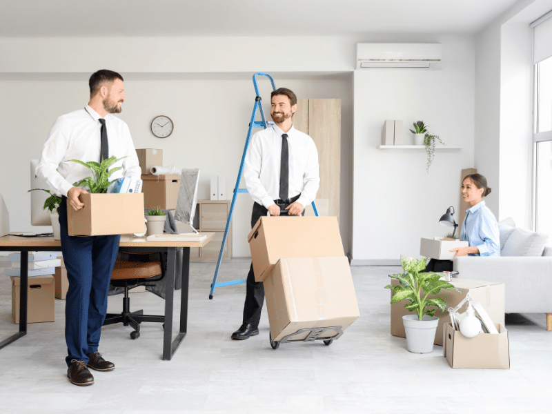 people moving business items into commercial storage
