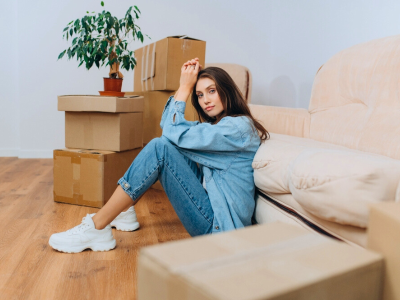 woman thinking about the Questions to Ask Before Moving
