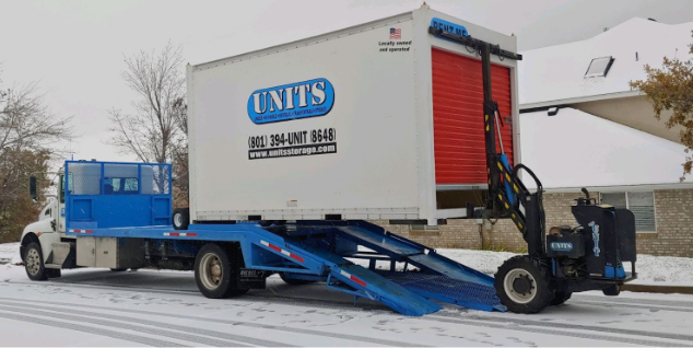 Units Of Utah container getting loaded onto a truck.