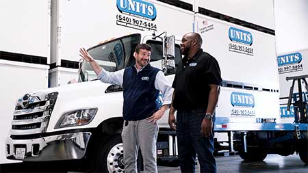 UNITS moving and portable storage representative talking to a customer