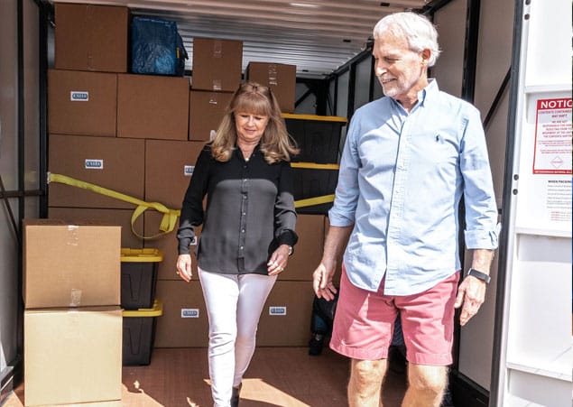 Elderly couple taking their time packing their UNITS moving and portablev storage containers