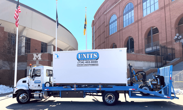 UNITS moving and portable storage truck parked outside of a commercial building