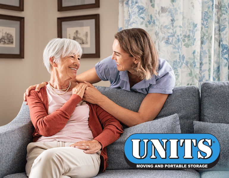 UNITS Portable storage logo and picture of a nurse standing and holding onto an elderly woman's hand who is sitting on a couch.
