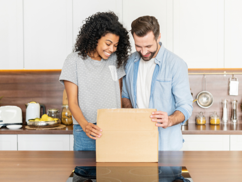 couple opening thier Housewarming Gifts